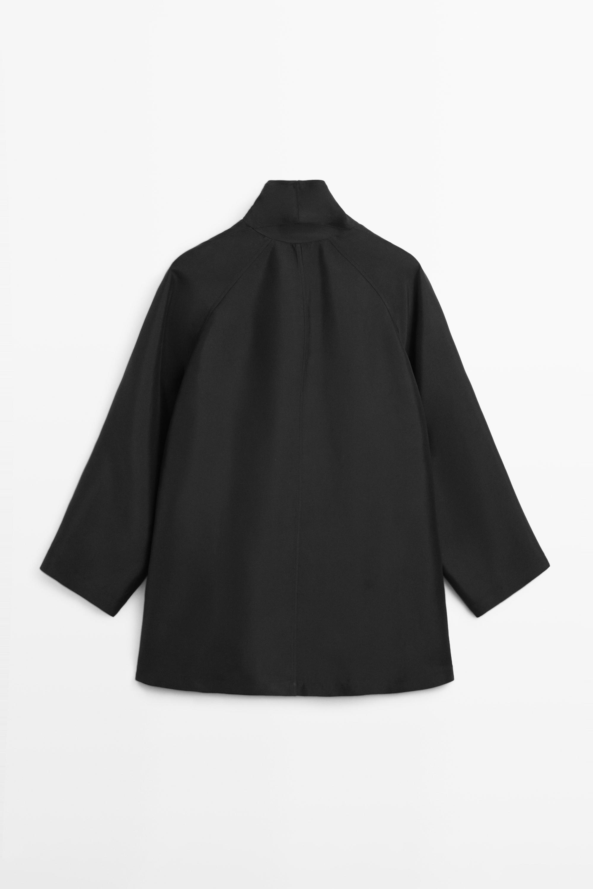 Flowing voluminous cape with button details